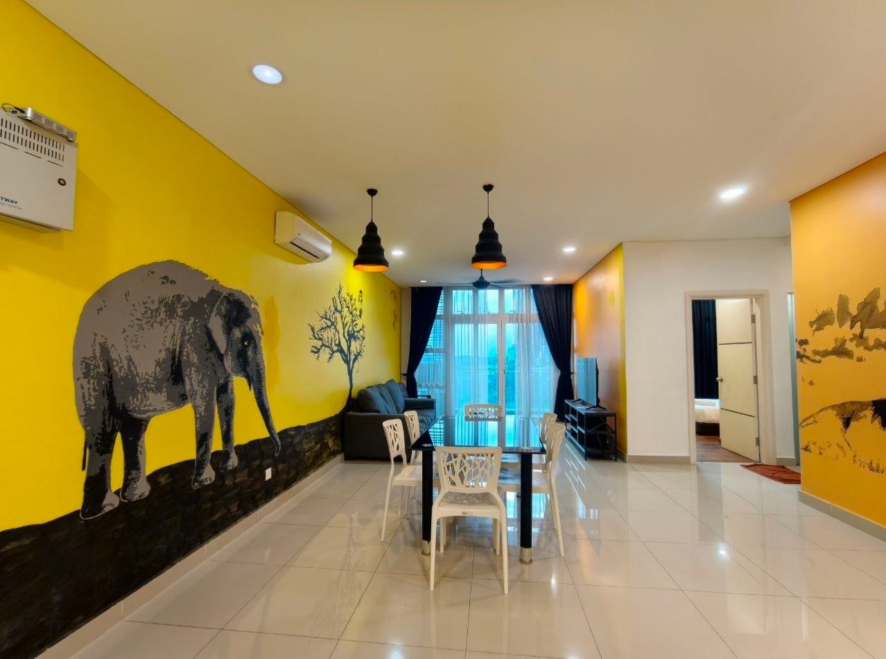 1Medini — Living and dining area with yellow feature walls