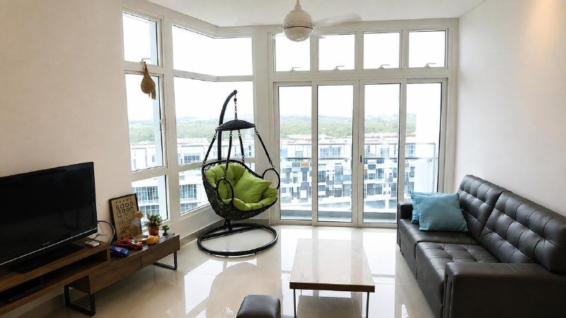 1Medini — Furnished living area with balcony doors